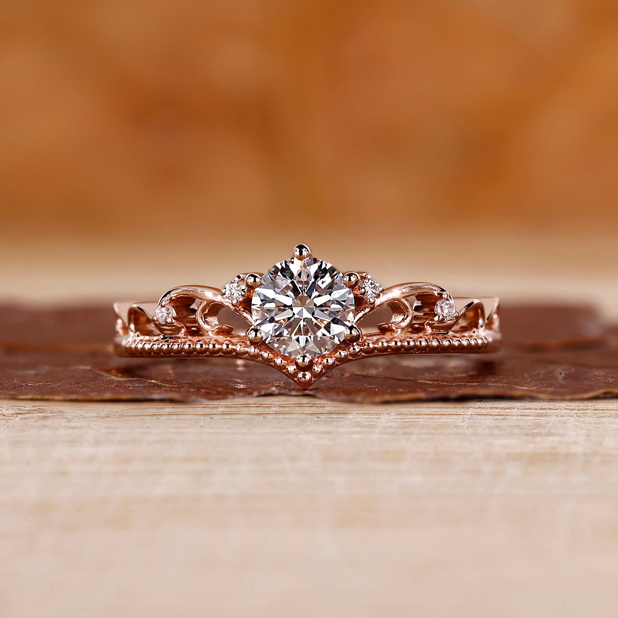 Vintage gold ring with a round diamond center.