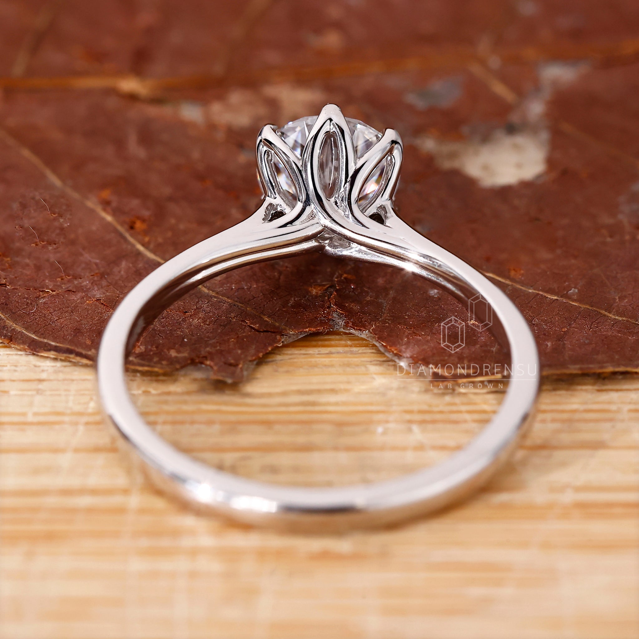 Diamond ring UK with prong setting and tapered shank