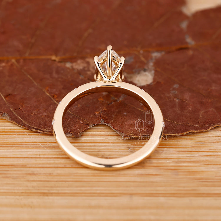Handmade marquise ring with round side stones.