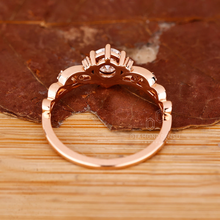 Custom engagement ring in vintage rose gold style.