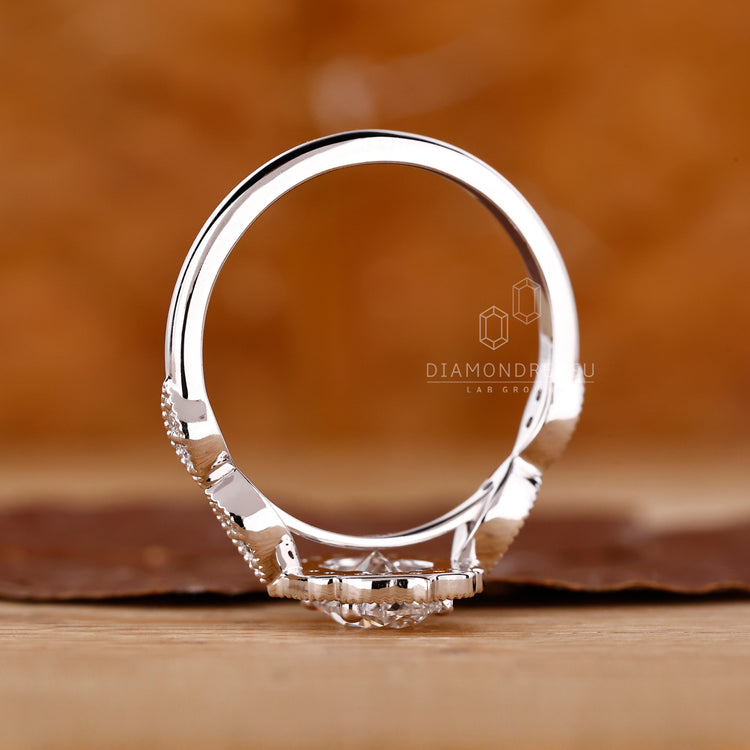White gold engagement ring with oval halo design.