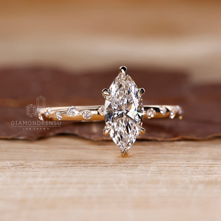 Yellow gold engagement ring with flush pave detail.
