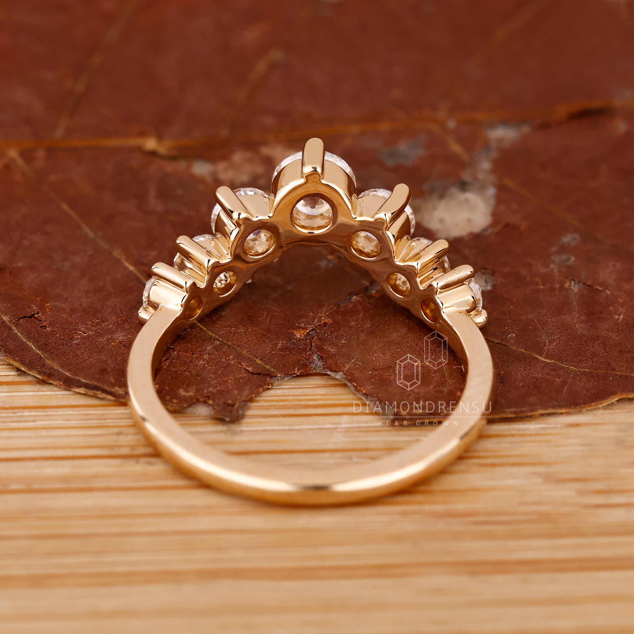 Handmade band with shared prong diamond setting.