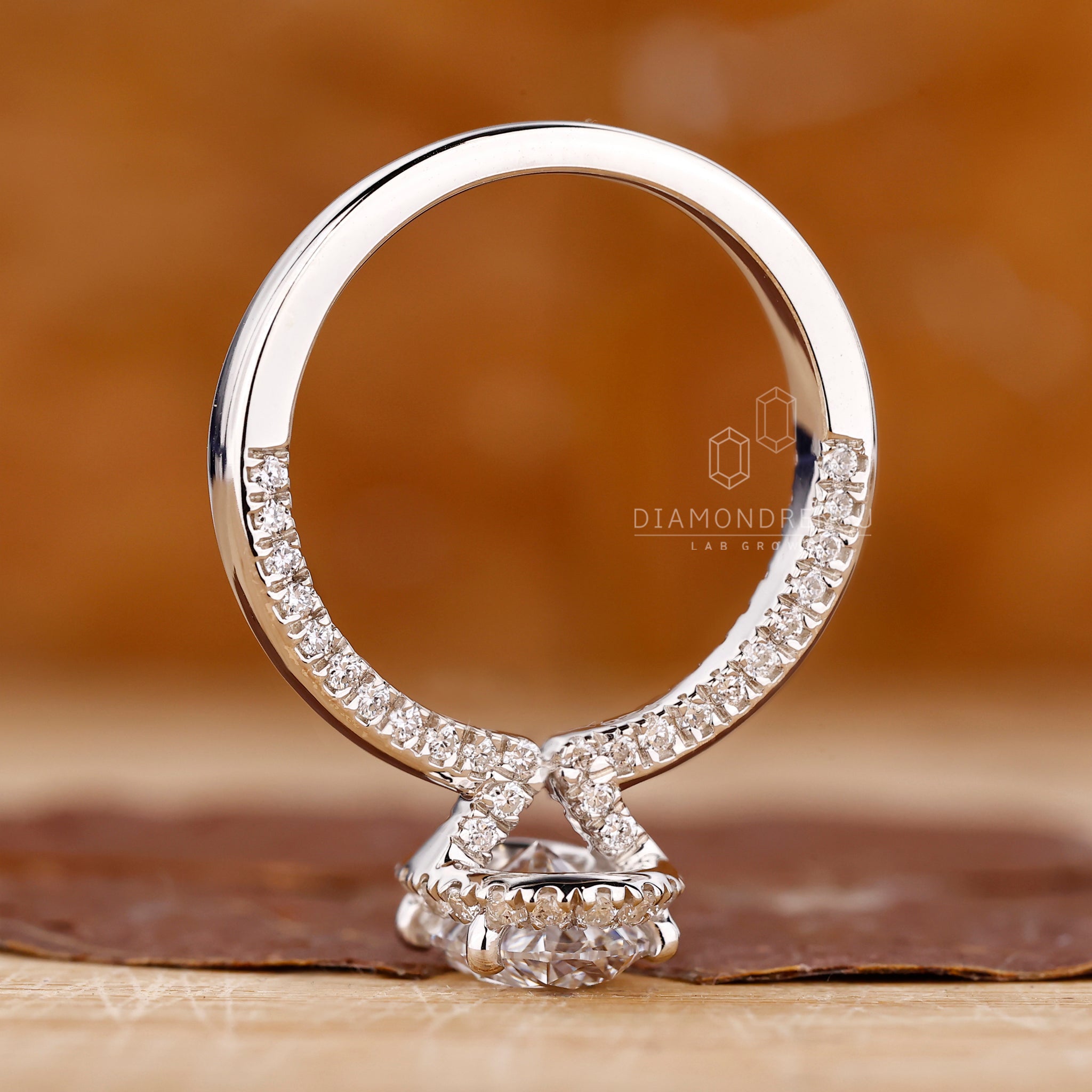 Four round prong setting diamond engagement ring