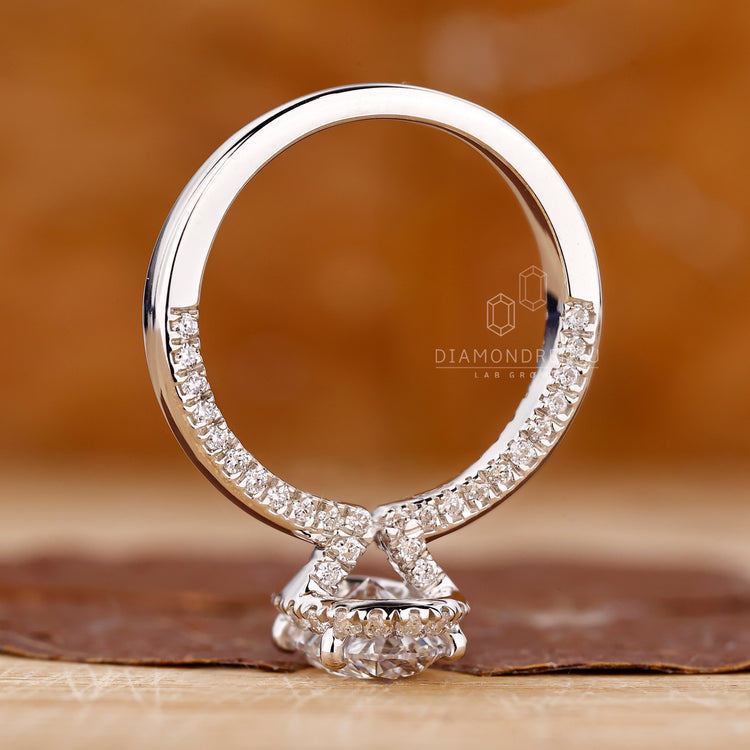 Four round prong setting diamond engagement ring