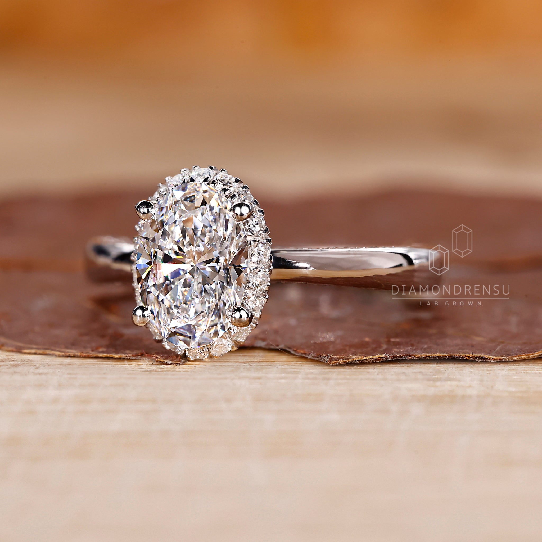 Oval diamond ring with tapered band and prong setting