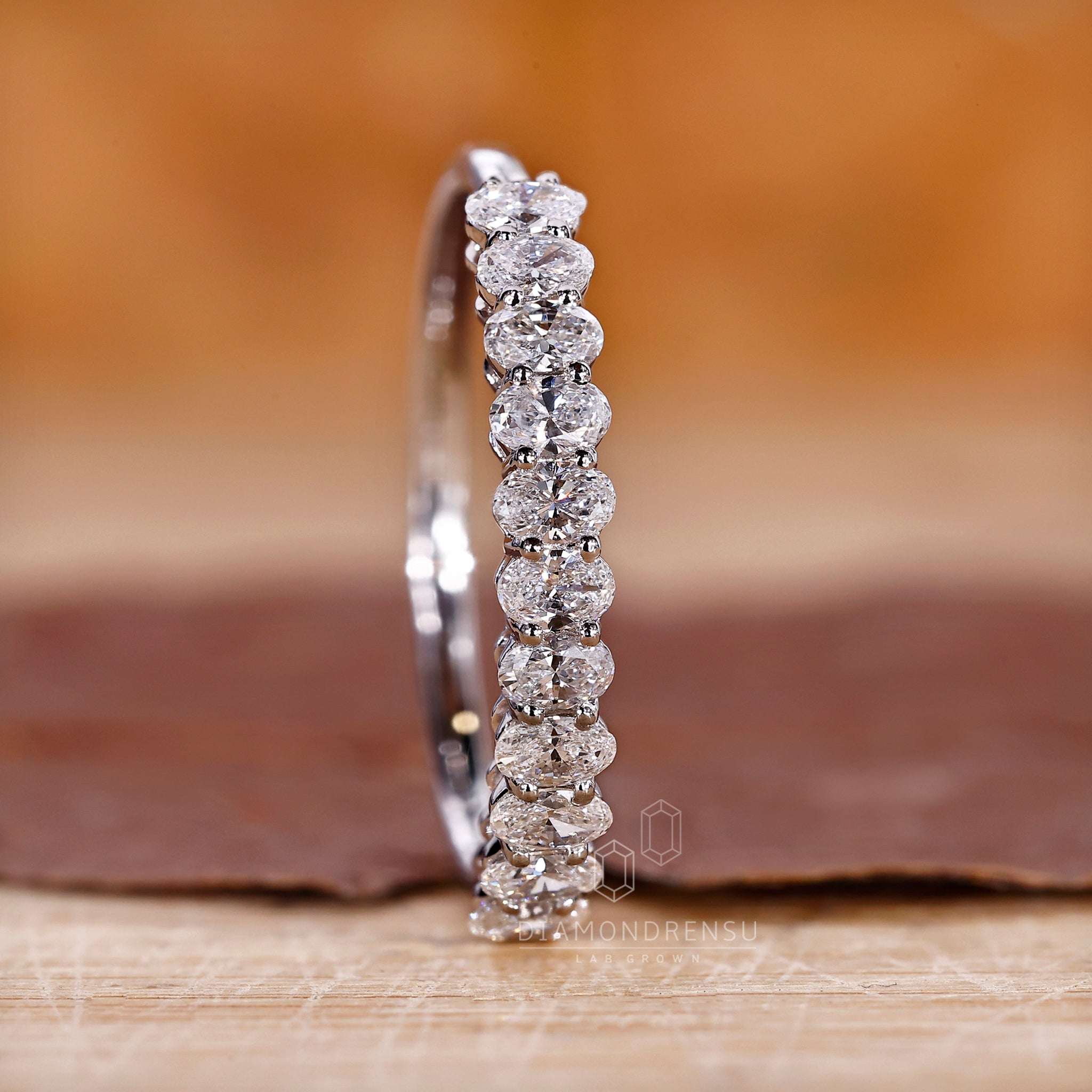Buy wedding band with oval diamonds and handmade craftsmanship.
