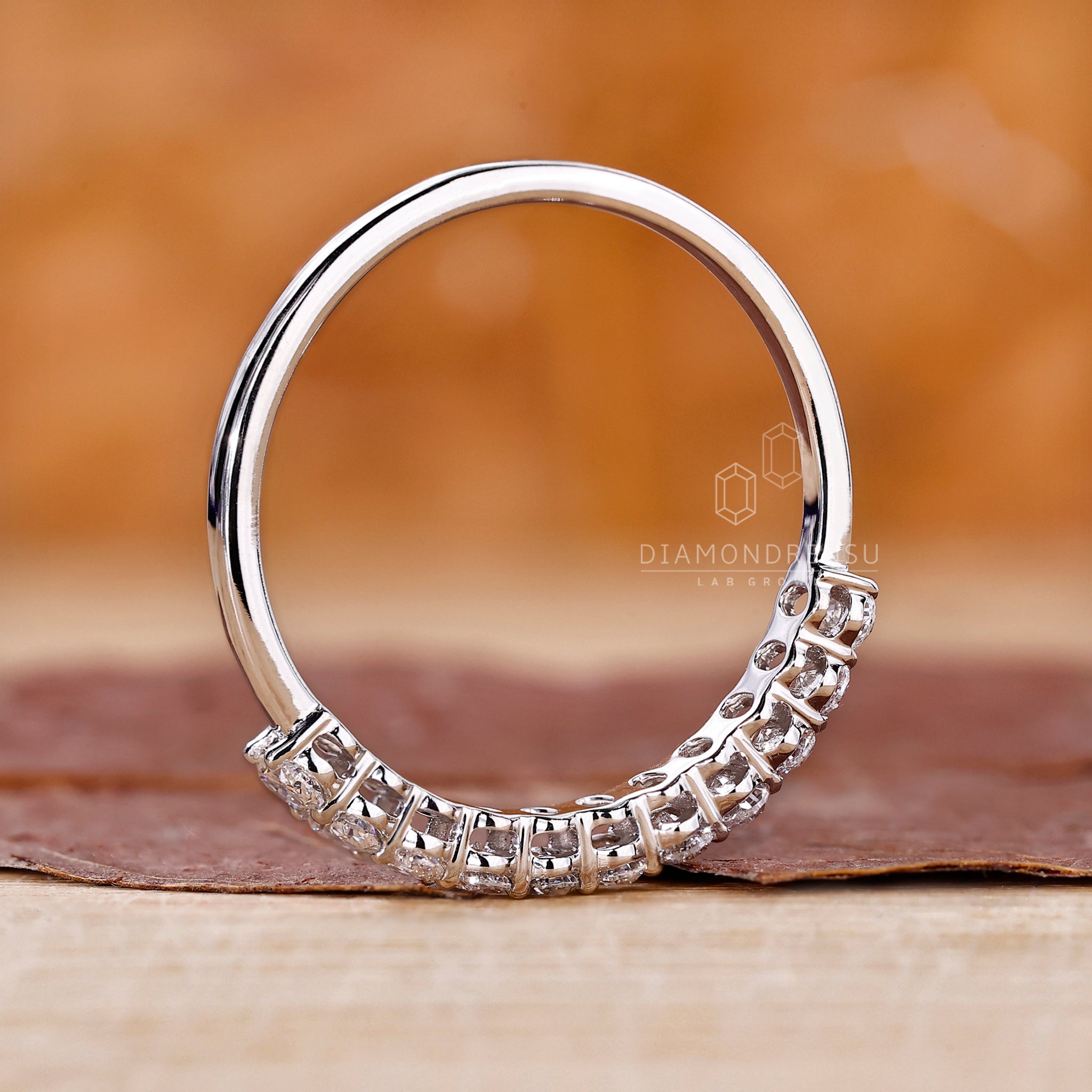 Lab Grown Diamond band in a prong set half eternity design.