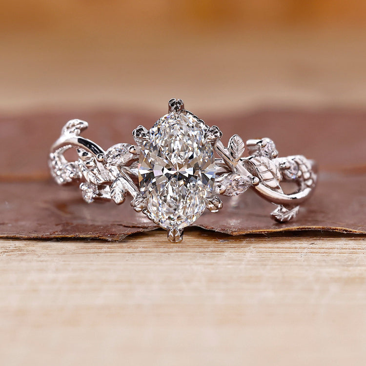 Oval Cut Diamond Ring designed with vine style detail.