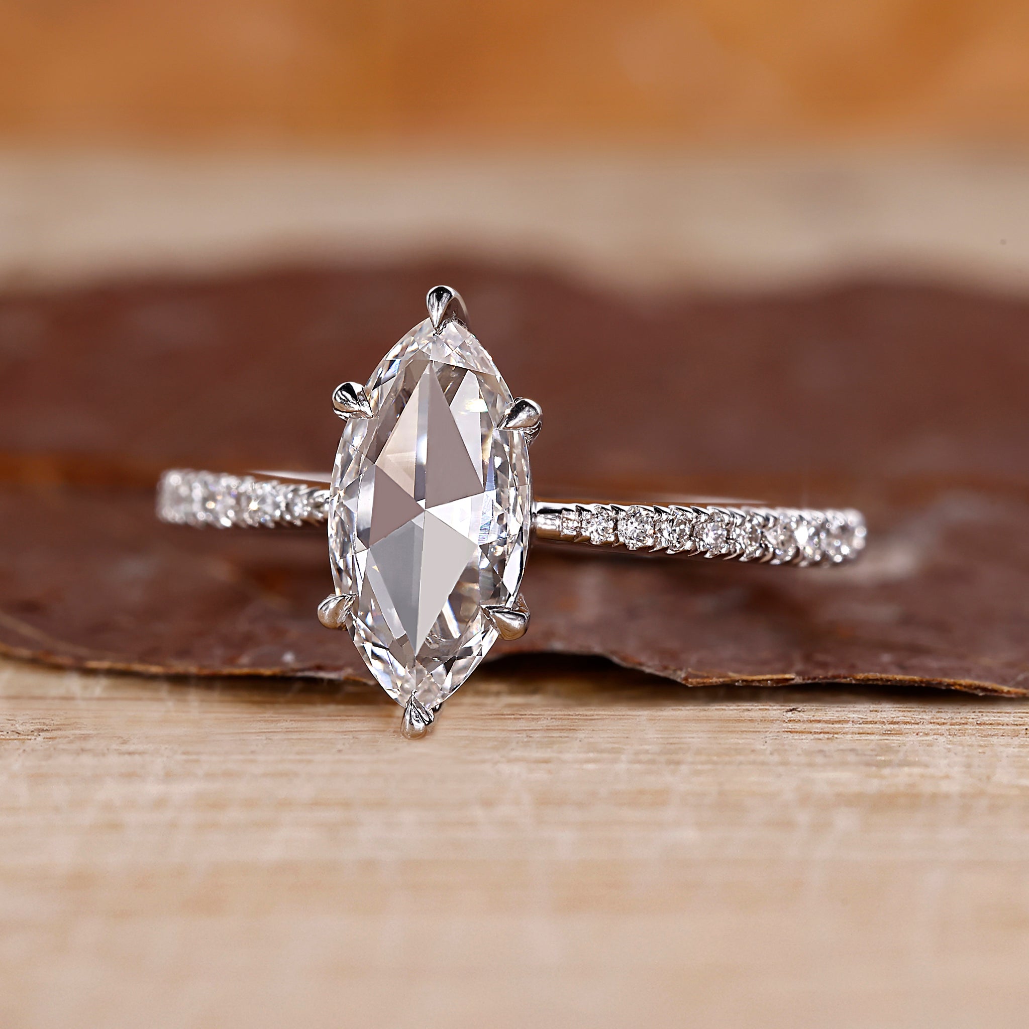 Rose cut engagement ring with a marquise diamond center.