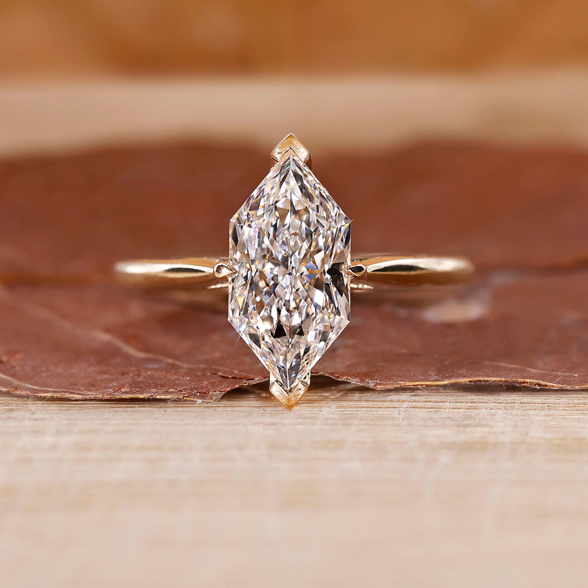 Dutch marquise diamond engagement ring crafted in cathedral setting.