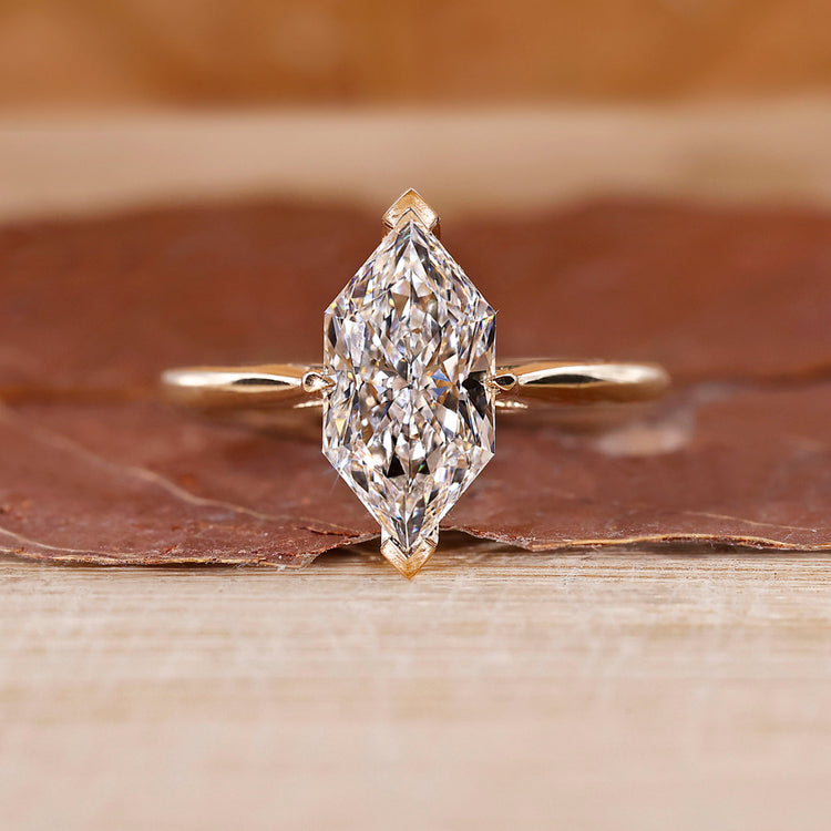 Dutch marquise diamond engagement ring crafted in cathedral setting.