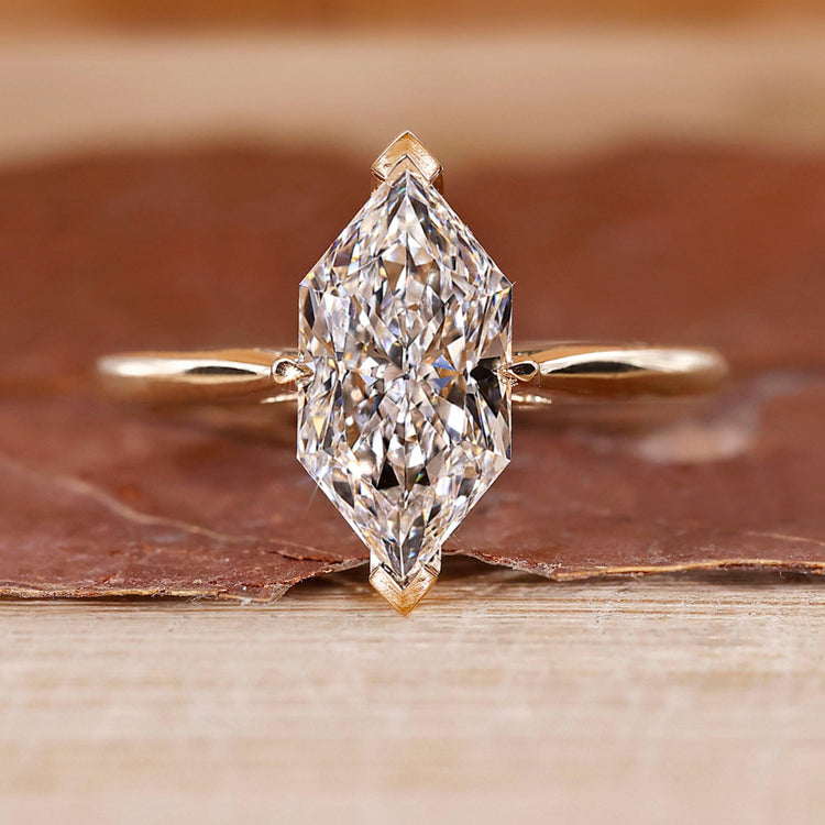 Dutch marquise diamond engagement ring crafted in cathedral setting.