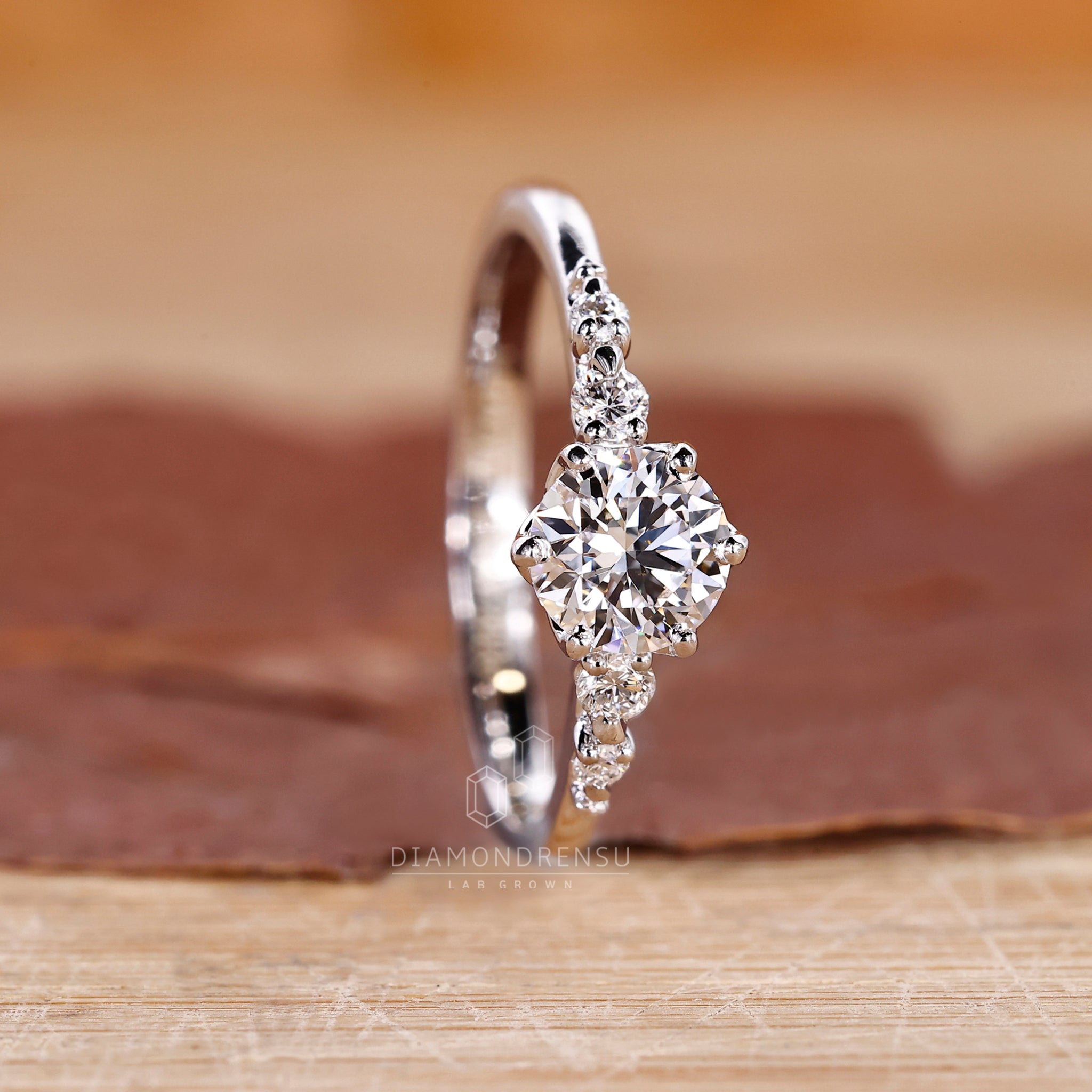 Six Round Prong Setting in lab grown diamond ring.