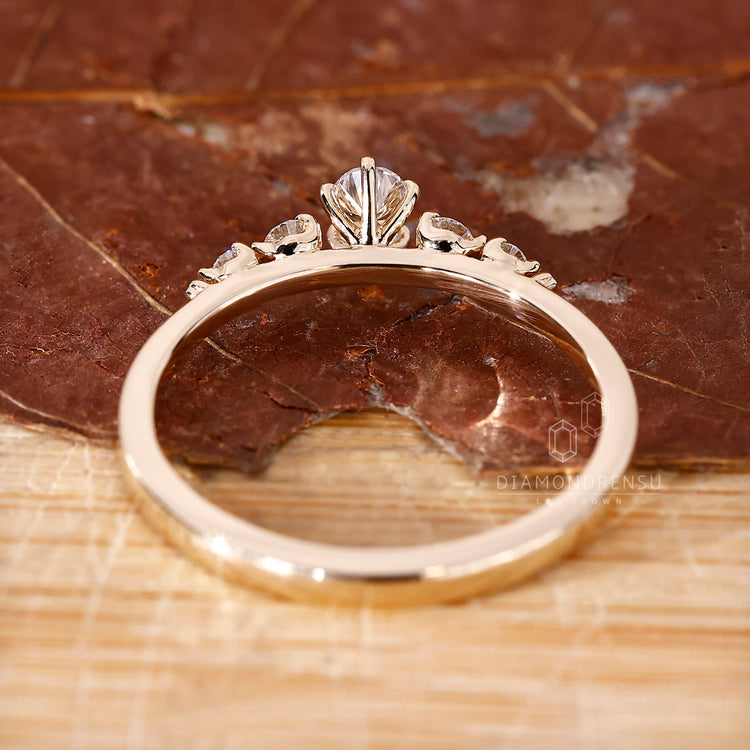 UK engagement ring with pear and round diamonds