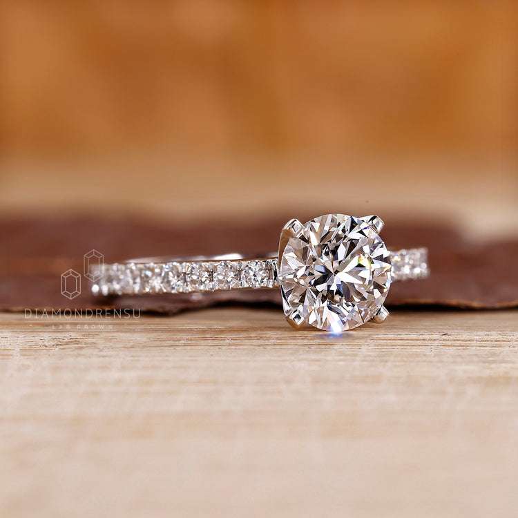 Prong setting enhances round cut stone.