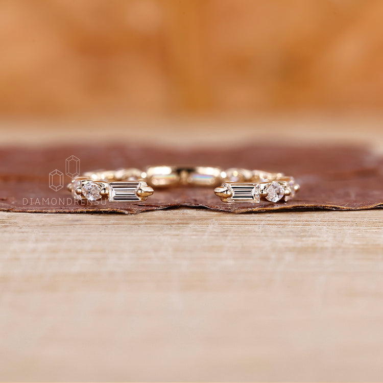 Eternity diamond band with lab grown stones and an open gap style.