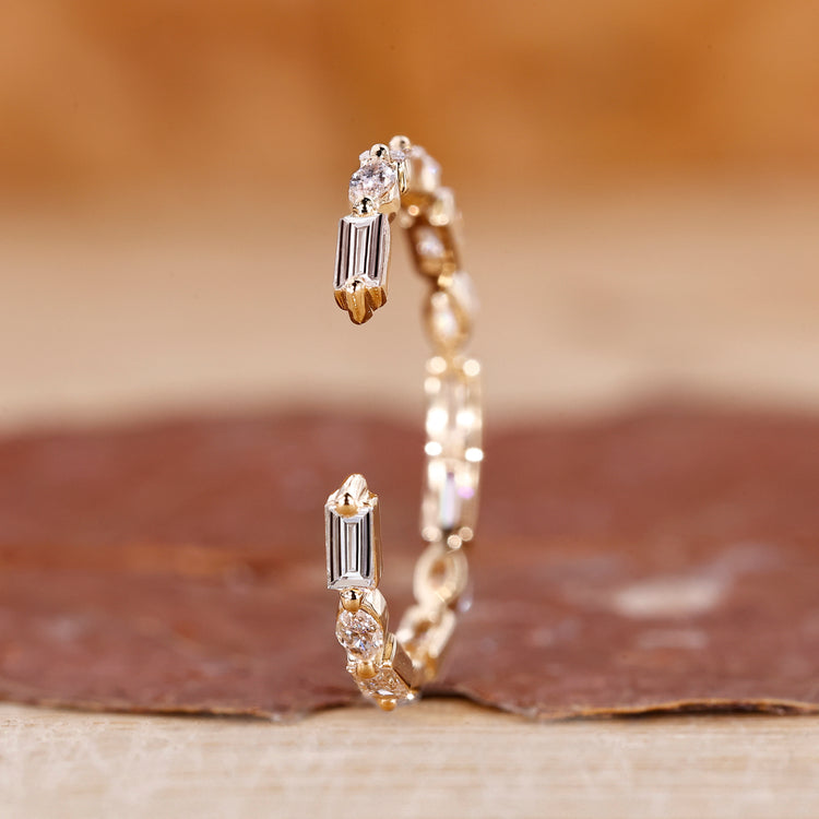 Open gap wedding band crafted in yellow gold with a bold modern style.