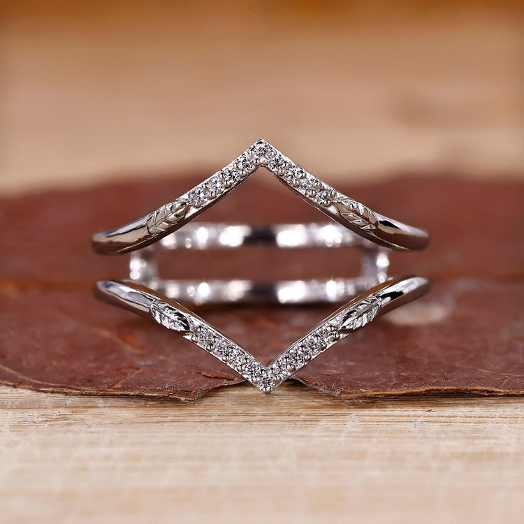 V shaped wedding band with round cut diamonds.