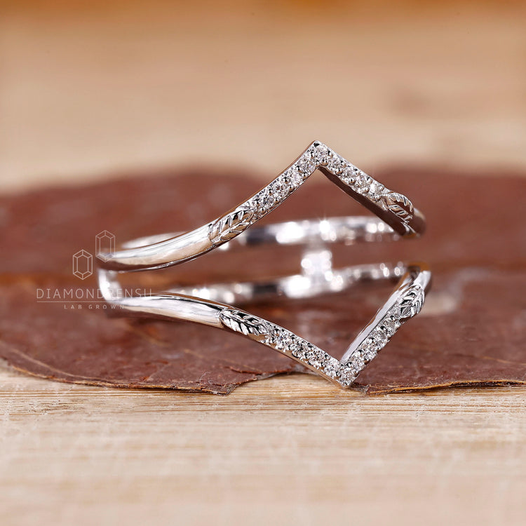 Ring enhancer wedding band in white gold finish.