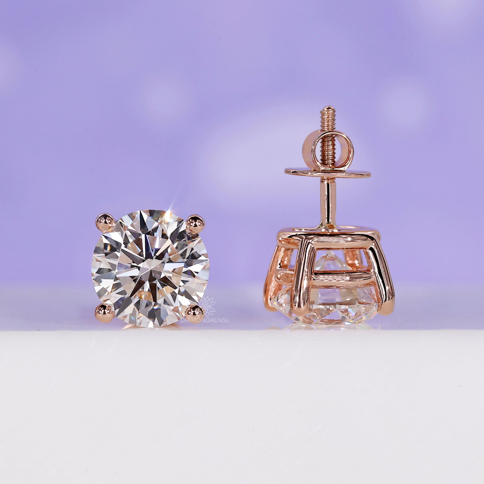 Prong setting diamond stud earrings.
