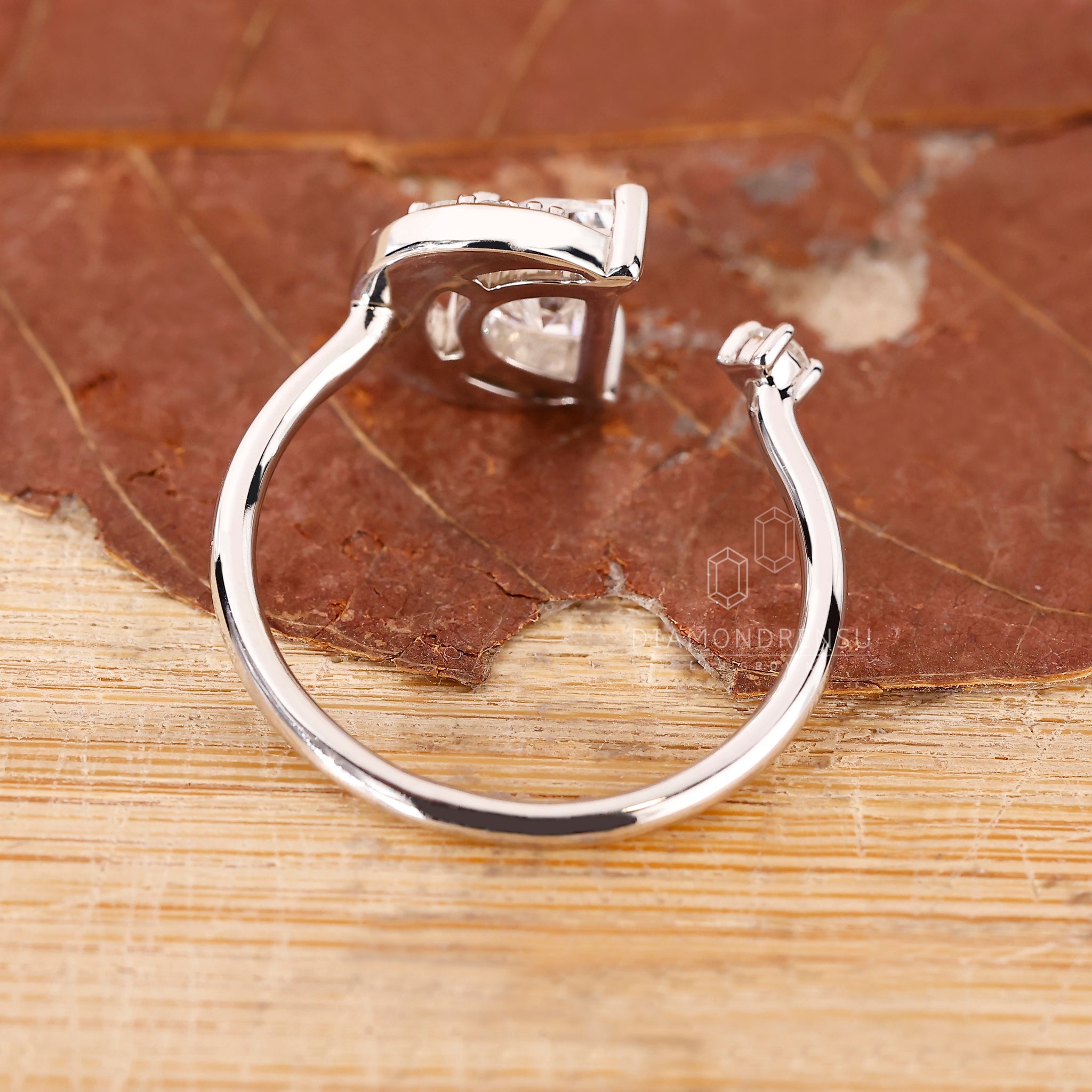 White gold ring with half moon cut side stones