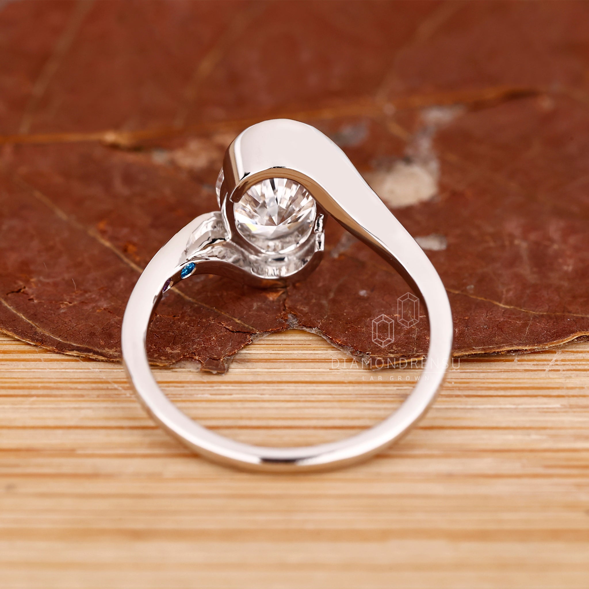 Buy engagement ring with oval diamond and bypass shank.