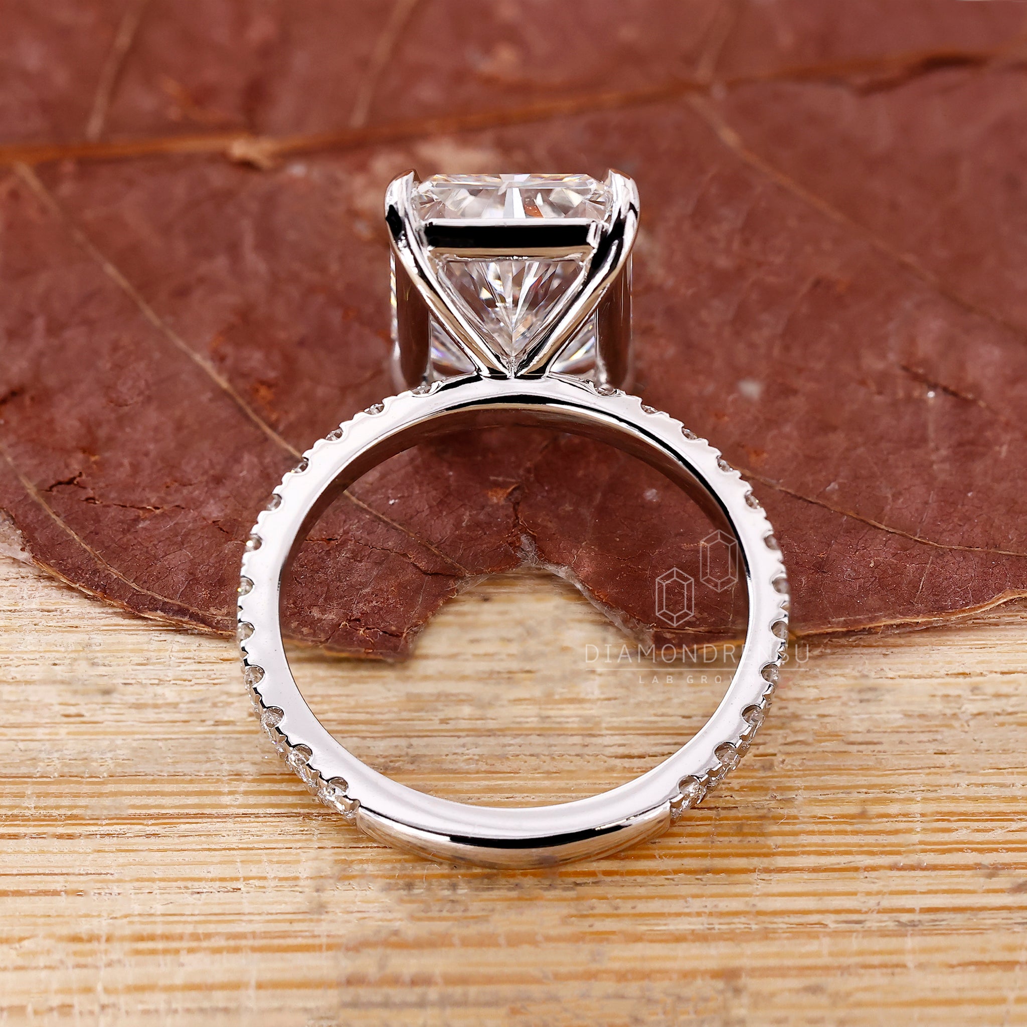 4 prong ring holds radiant diamond at the center.