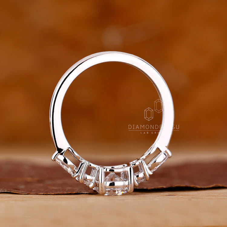 Custom engagement ring with tapered band and prong setting.