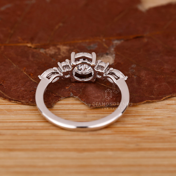 White gold engagement ring with marquise and round mix.