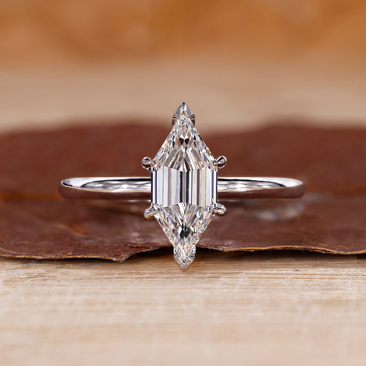 Hexagon ring designed with elongated hexagon step cut diamond.