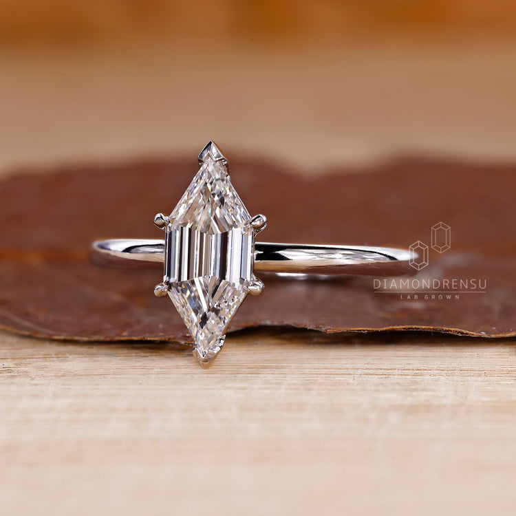 UK engagement ring designed with V and claw prong setting.