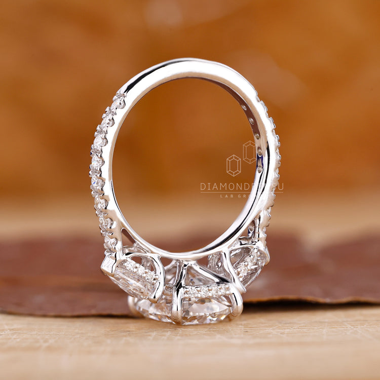 White Gold Ring features center and side diamonds.