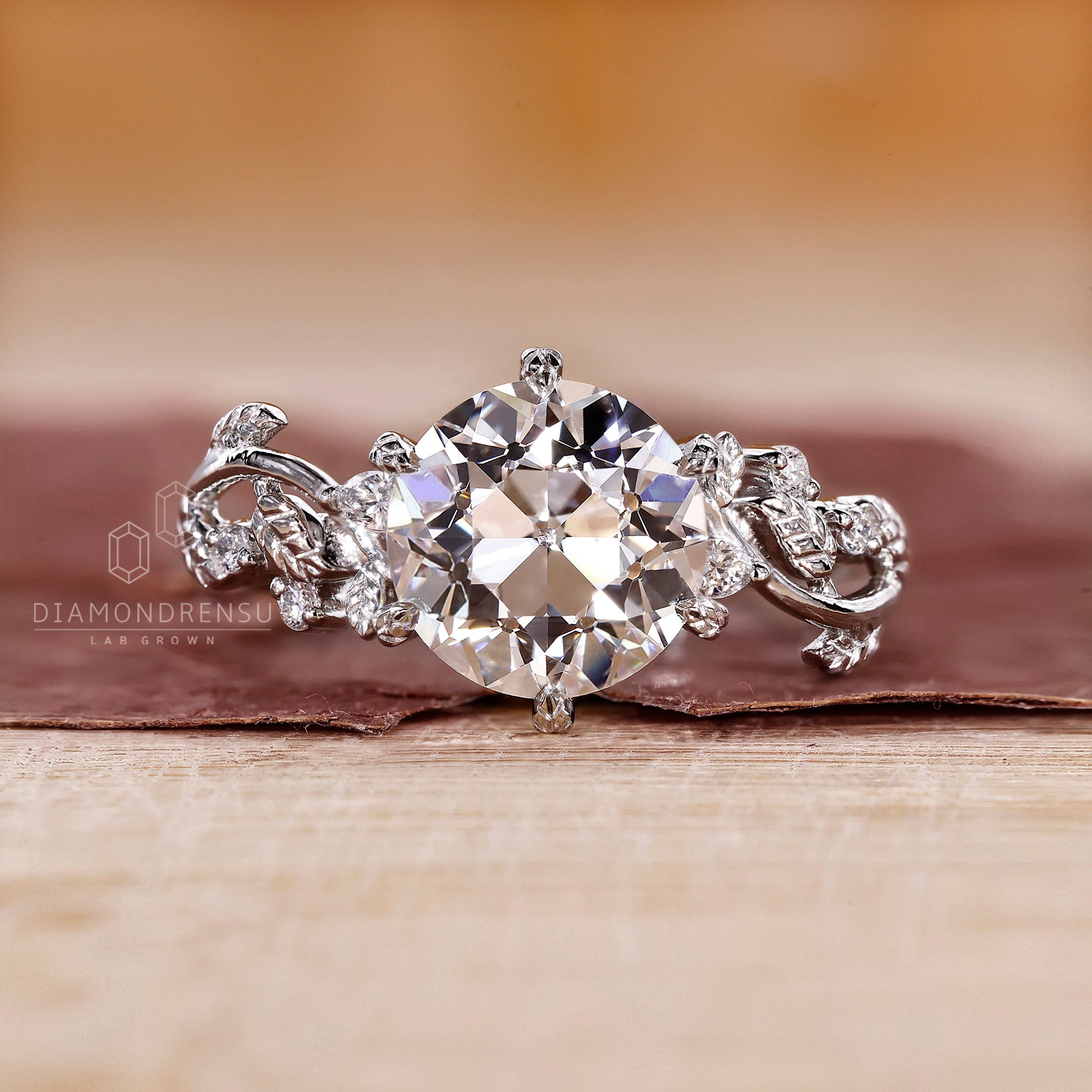 Vintage white gold ring crafted with marquise side stones and handmade detailing.