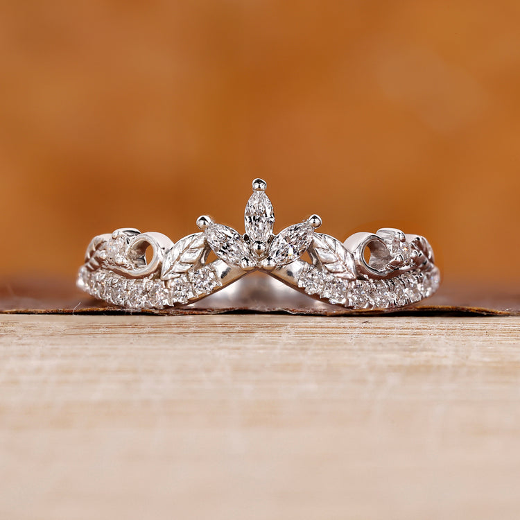 Round and marquise diamond wedding band in white gold.