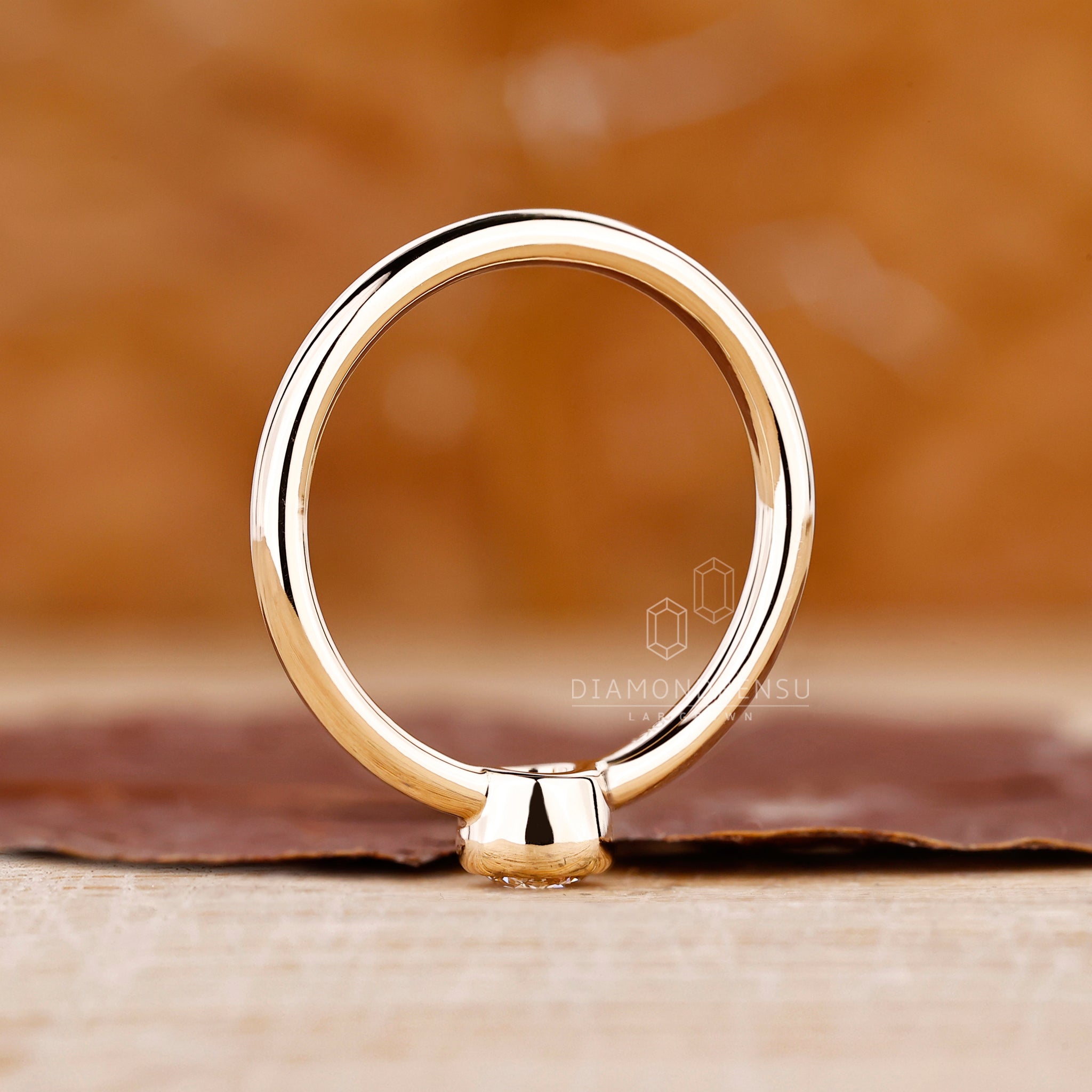 Custom engagement ring in yellow gold ring setting.