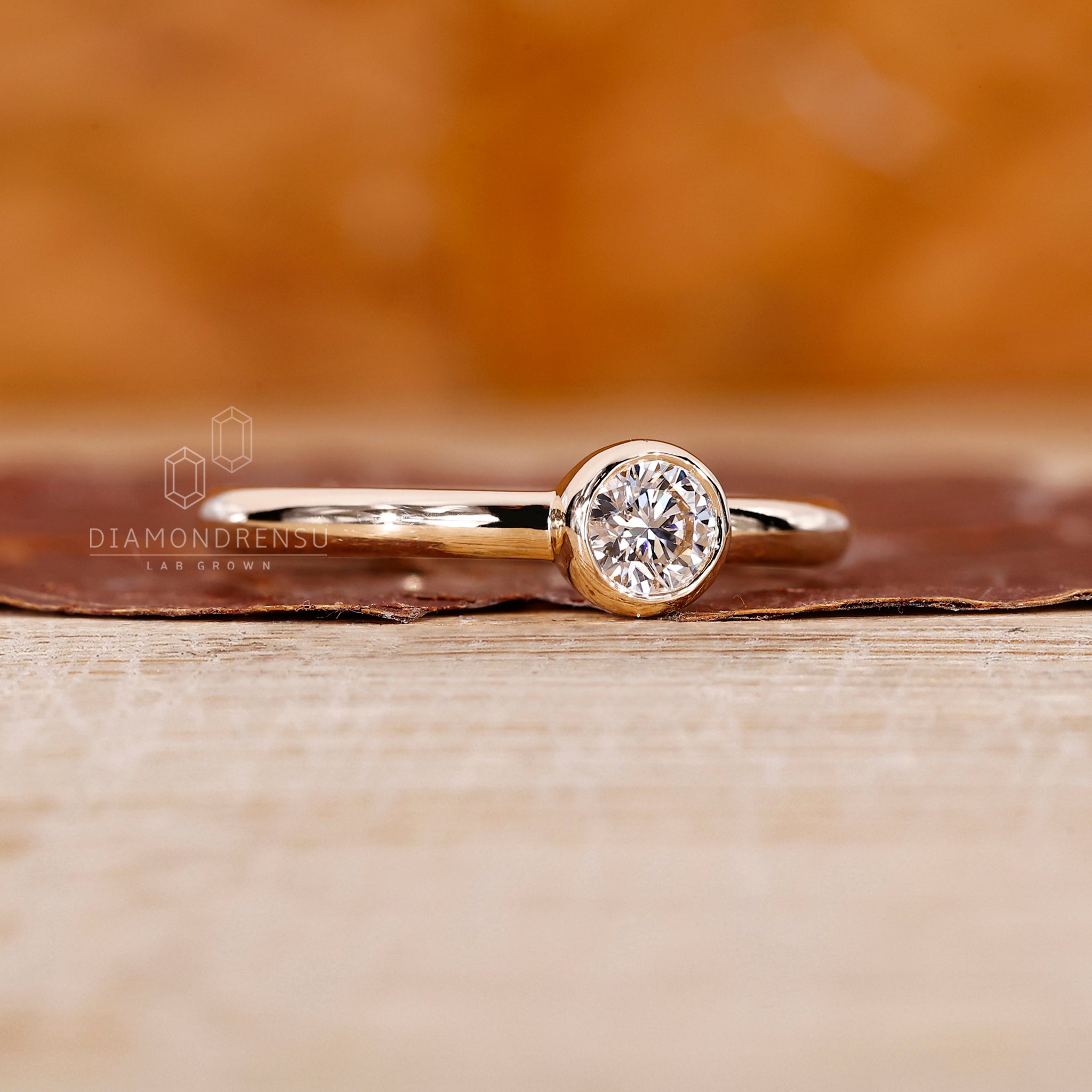 Round cut diamond used in bezel setting ring finish.