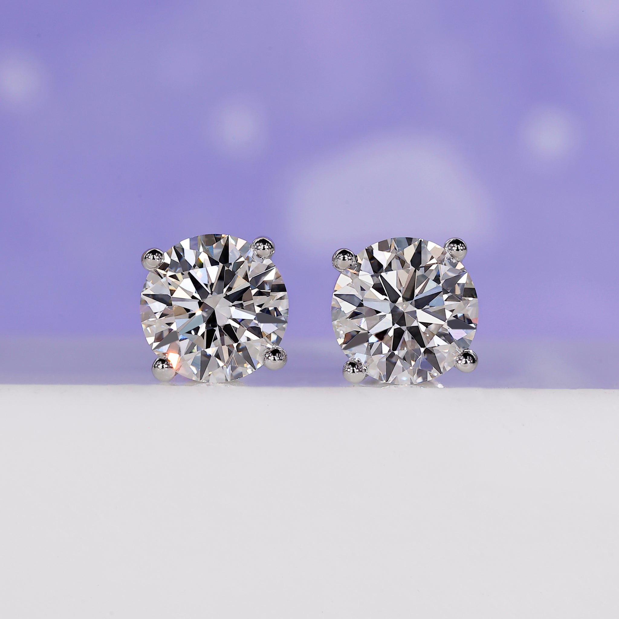 4 carat round diamond stud earrings.