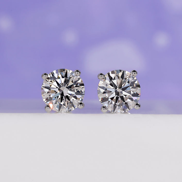 4 carat round diamond stud earrings.