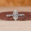 Marquise diamond engagement ring with 4 claw prong setting.