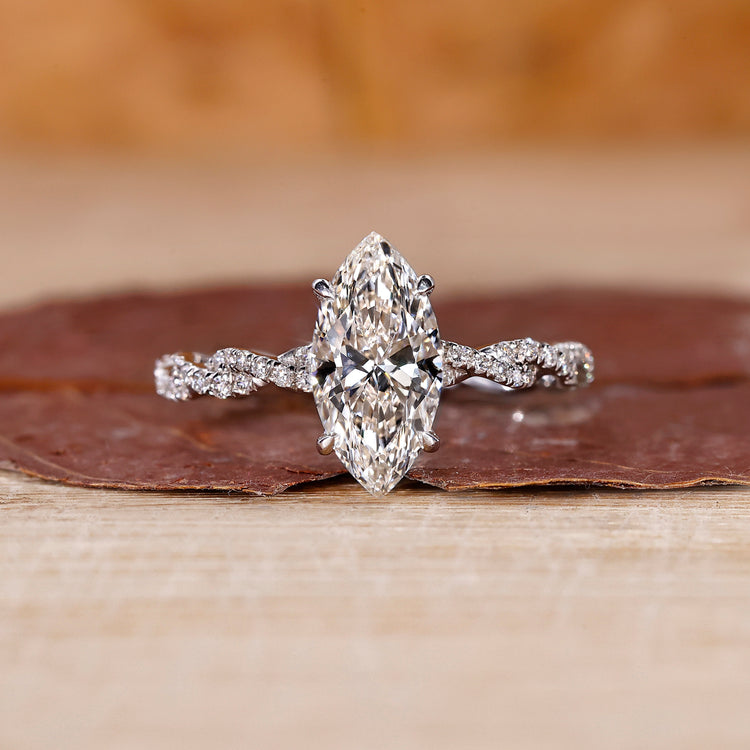 Marquise diamond engagement ring with 4 claw prong setting.