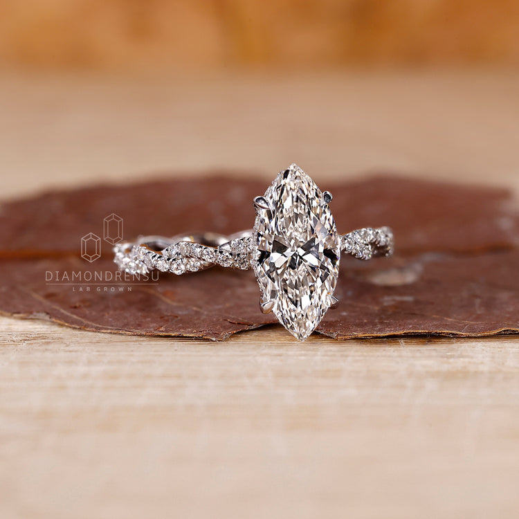 White gold engagement ring crafted in round cut twisted band.