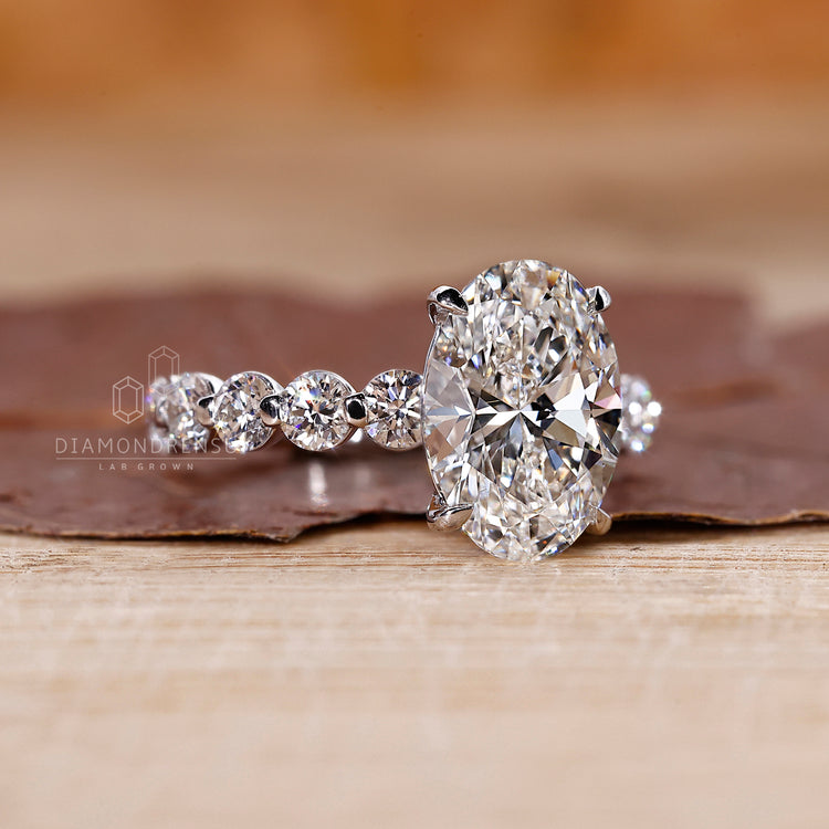4 claw prong ring supports oval shape diamond.
