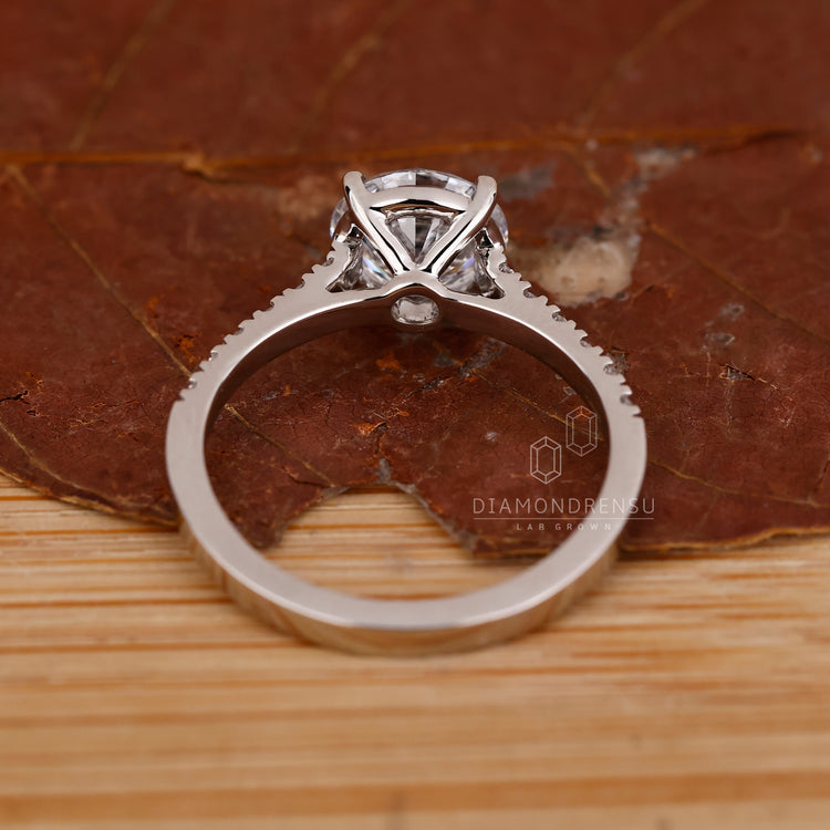 Handmade white gold engagement ring with round diamond
