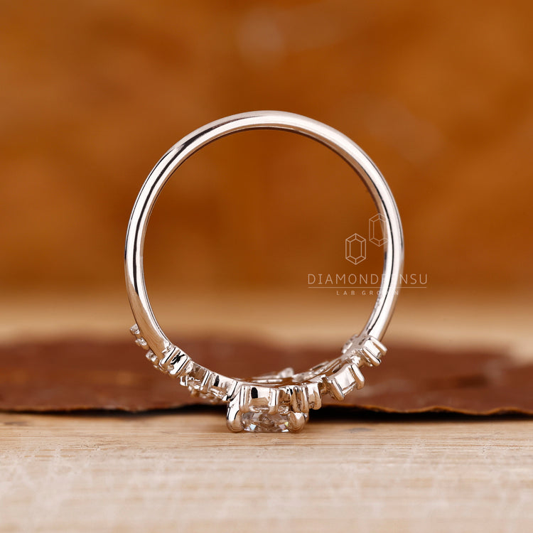 Unique ring featuring round and marquise diamonds.