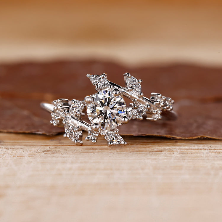 Nature inspired diamond ring with marquise and round mix.