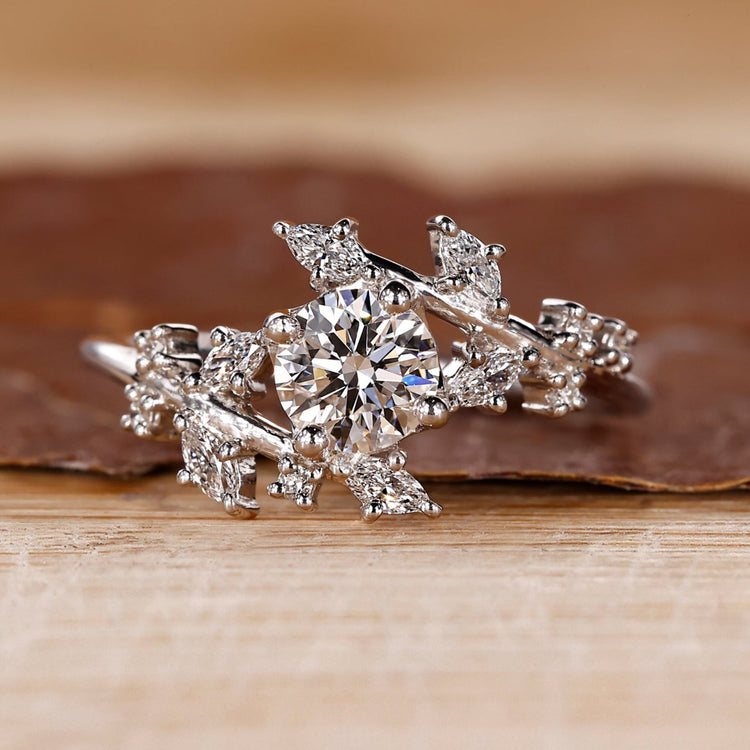 Nature inspired diamond ring with marquise and round mix.