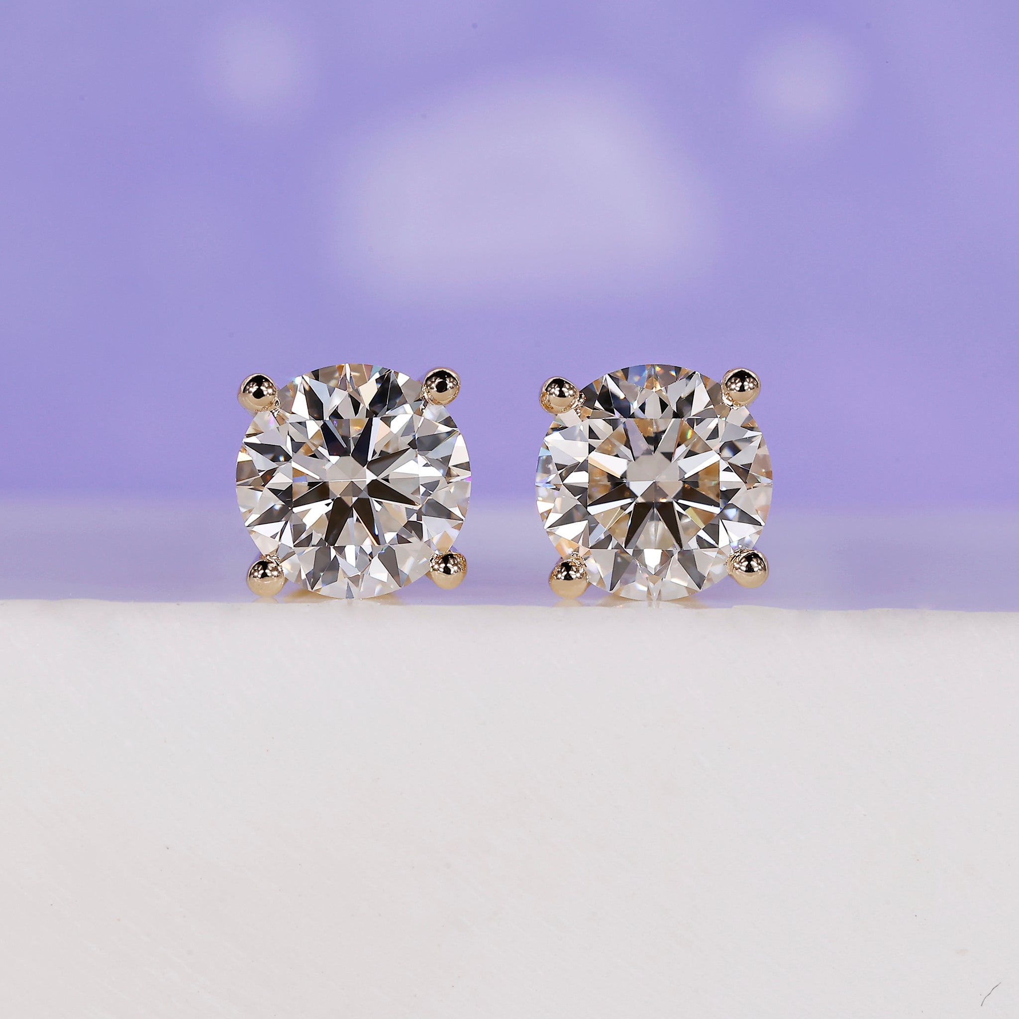3 carat total weight diamond stud earrings.