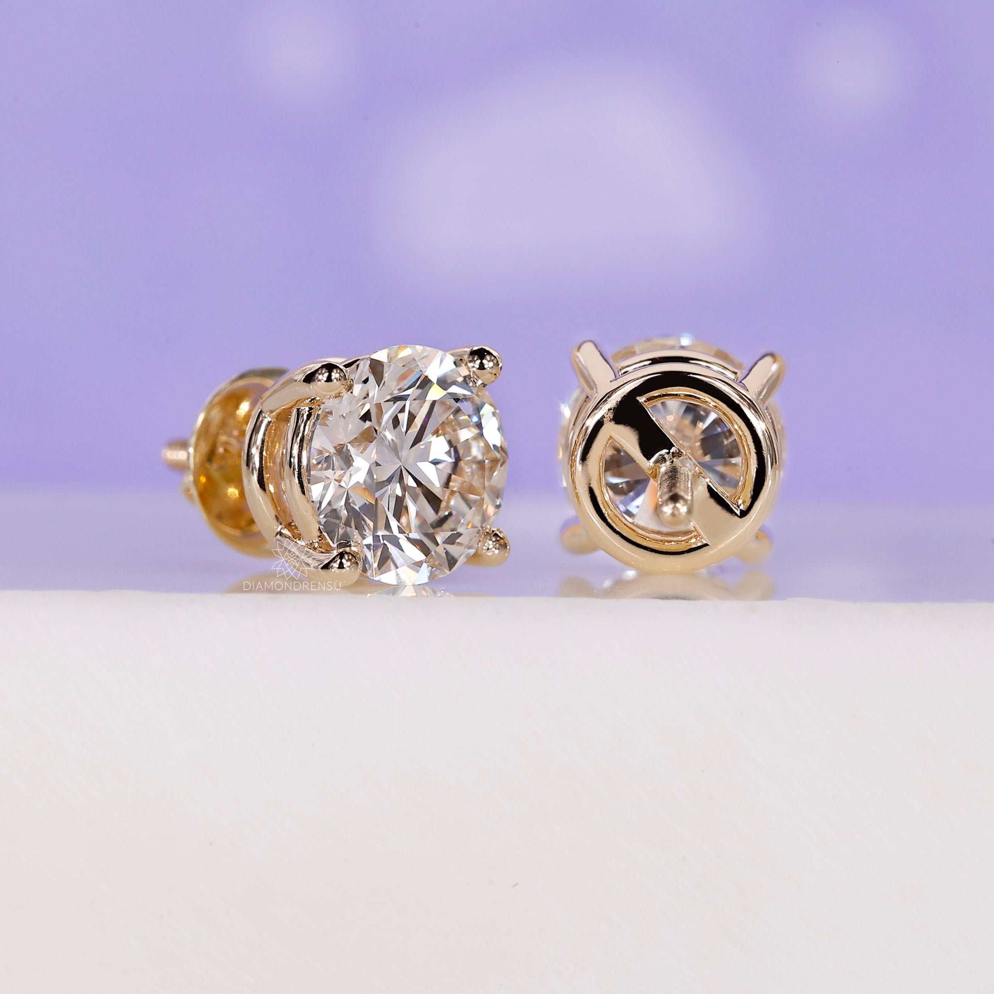 Yellow gold diamond stud earrings.