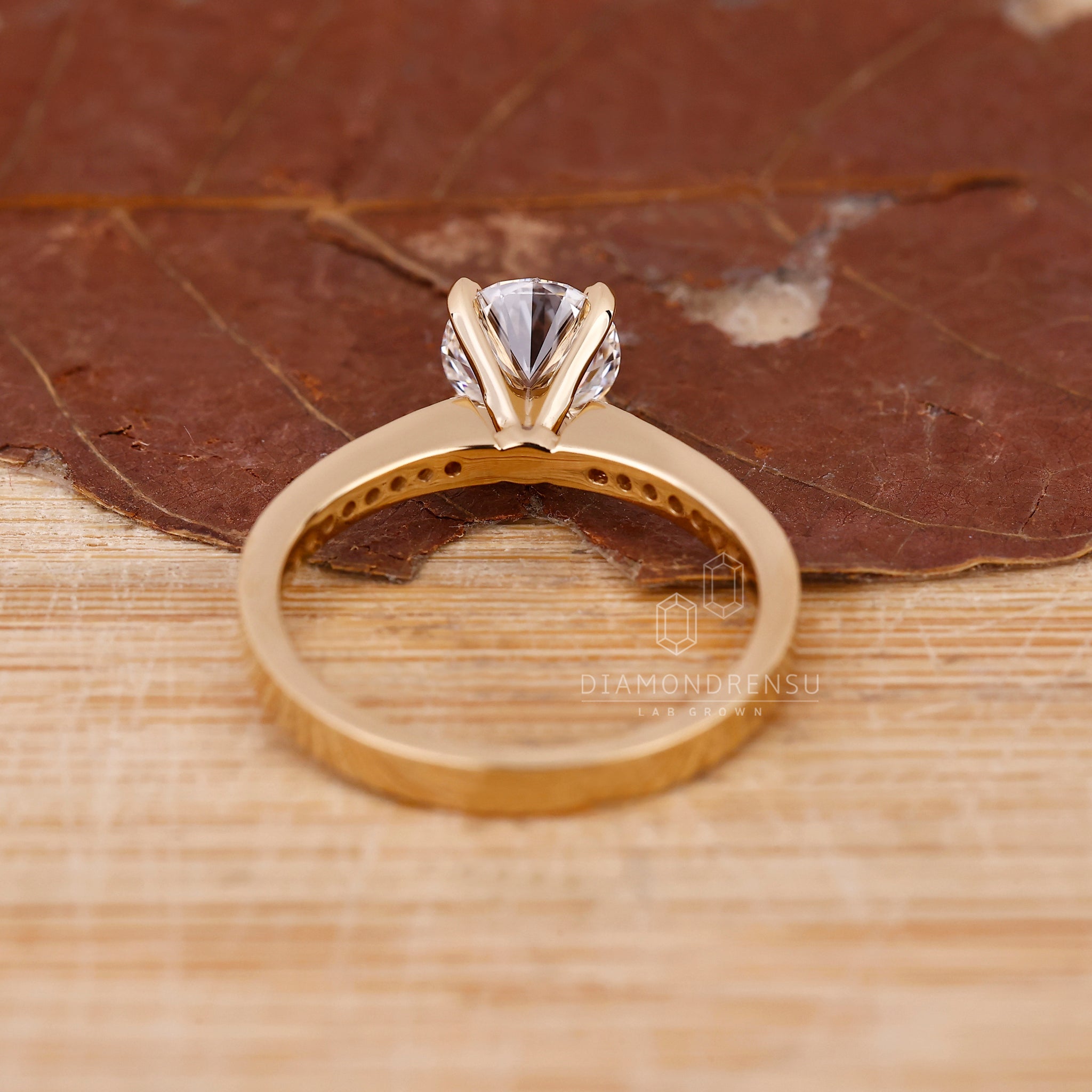 Lab Grown Diamond in round diamond channel set ring.